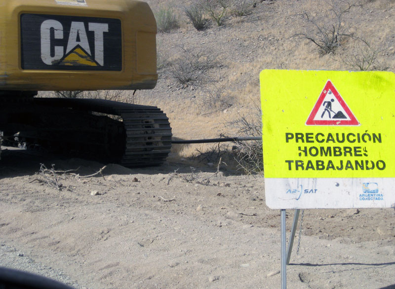 Panneau hombres trabajando